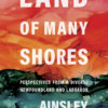 La couverture du livre Land of many shores d'Ainsley Hawthorn. Le texte est blanc et grand et il y a une scène au fond avec un ciel orange et une terre verte et bleue